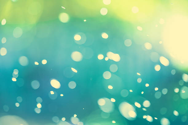 istock Bokeh Background With Sparkles - Green Blue And Yellow 606192338