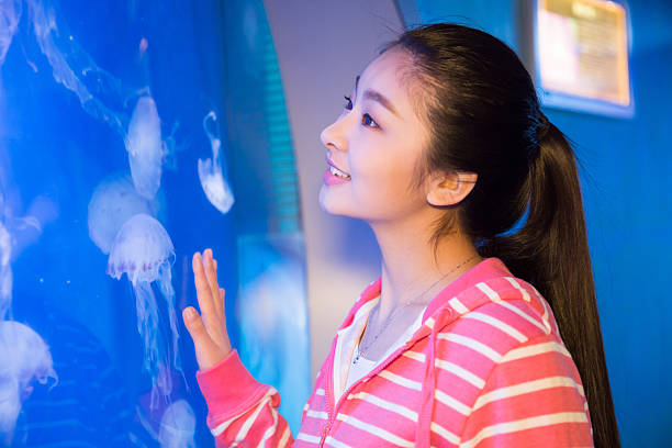 istock girls visit the aquarium 606193020