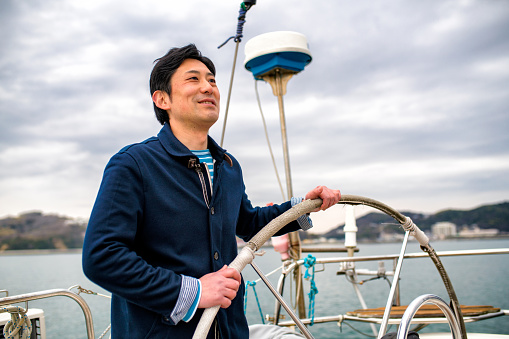 Man relaxing on a luxury yacht. Okayama, Japan. March 2016