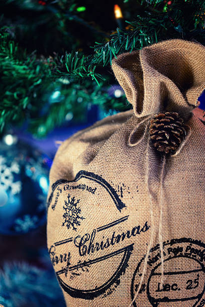 istock Santa Claus Bag under Christmas tree, Xmas festive background 606199016