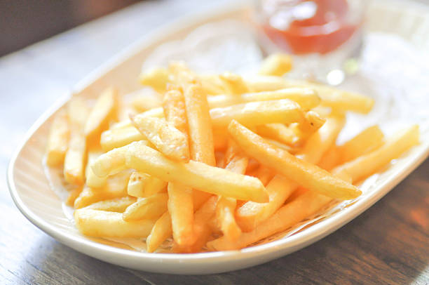istock French fries  and ketchup dip in soft focus 606199084