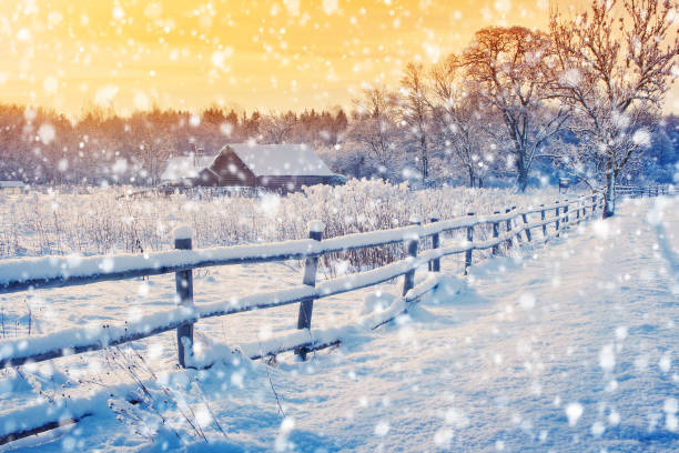 istock Rural house with a fence in winter 606200562