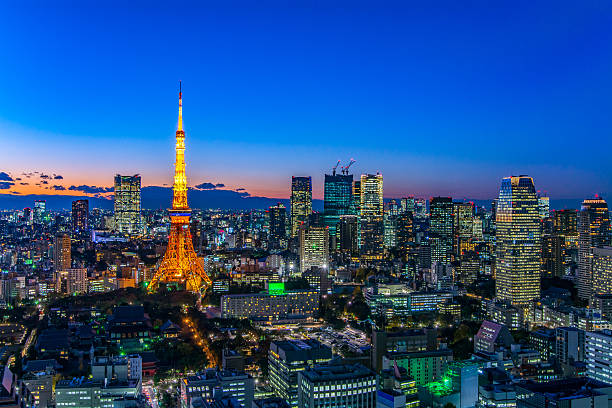 Tokyo area dense building nightscape and Tokyo tower stock photo