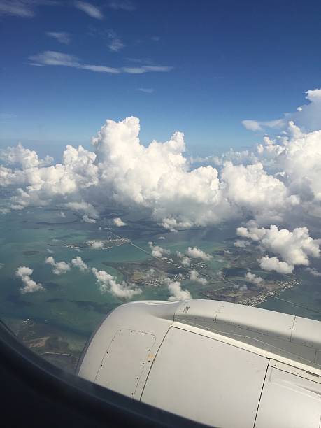 istock airplane view of tropical ocean 606203178