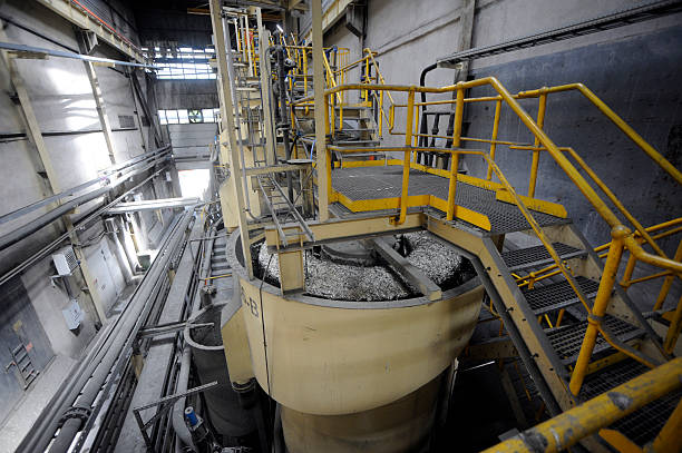 istock Mine blender crashing raw material in miner facility 606203190