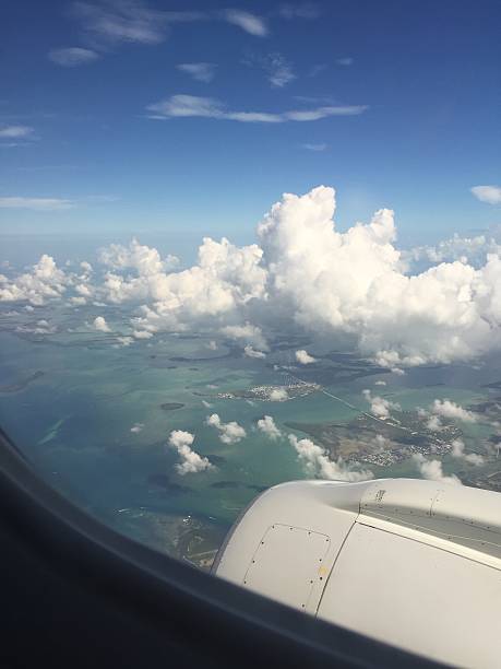 istock airplane view of tropical ocean 606203584