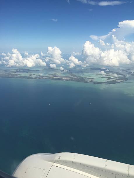istock airplane view of tropical ocean 606203734