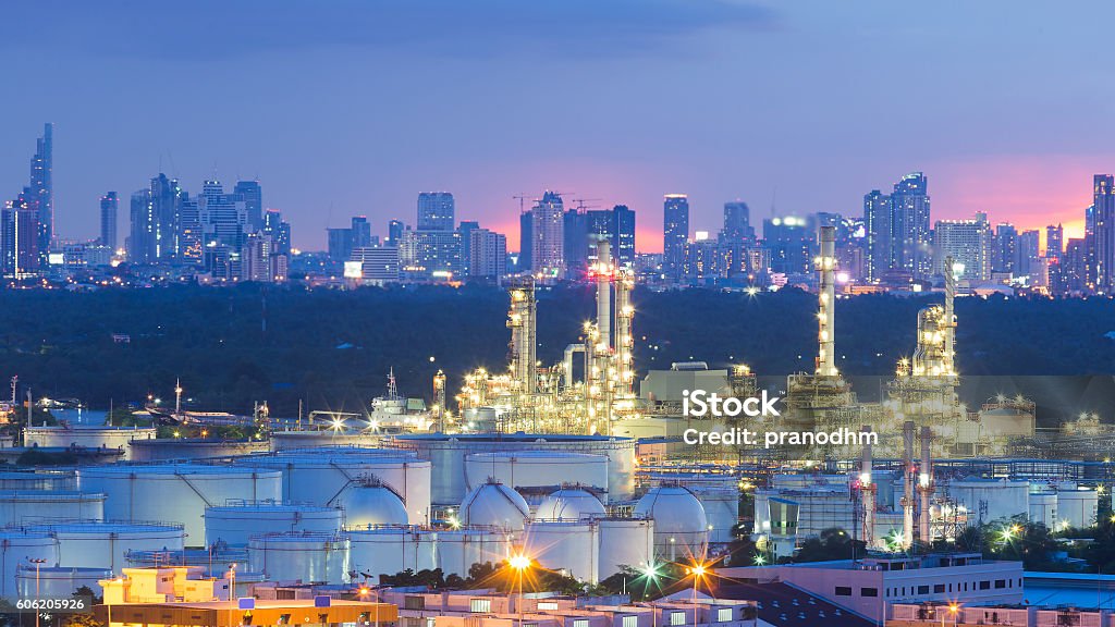 Oil refinery and Tank with city downtown Oil refinery and Tank with city downtown background night view Bangkok Stock Photo