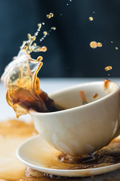 istock Splash of coffee in white cup 606209272