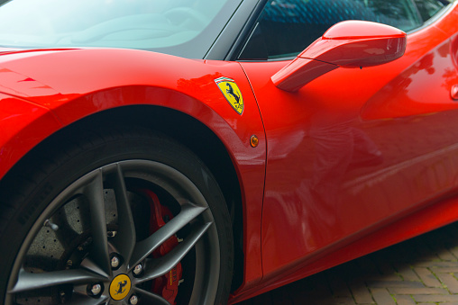 Zwolle, The Netherlands - September 3, 2016: Detail on a red Ferrari 488 GTB sports car pakred on the street. The Ferrari 488 GTB (Tipo F142M) is a mid-engined sports car powered by a 3.9-litre twin-turbocharged V8.