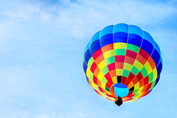 istock sinlge hot air balloon colorful blue sky background fly 606214430