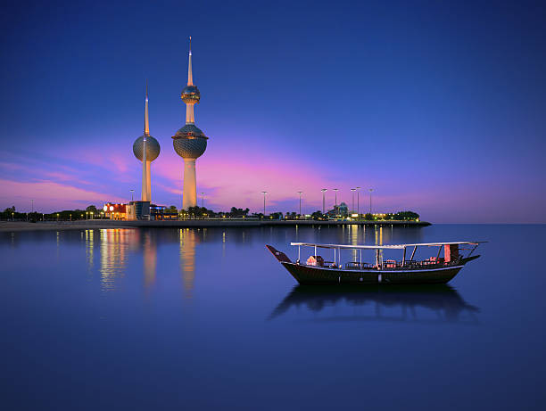 kuwait, landmarks, night, sunset, dusk, blue, boat, tower, calm Arabian passenger boat during blue hour next to kuwait tower calm water photos stock pictures, royalty-free photos & images