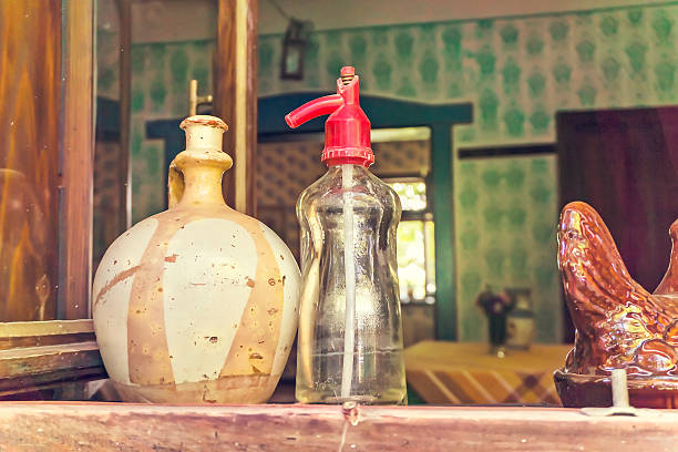 Still nature of vintage soda bottle and old stule clay pitcher