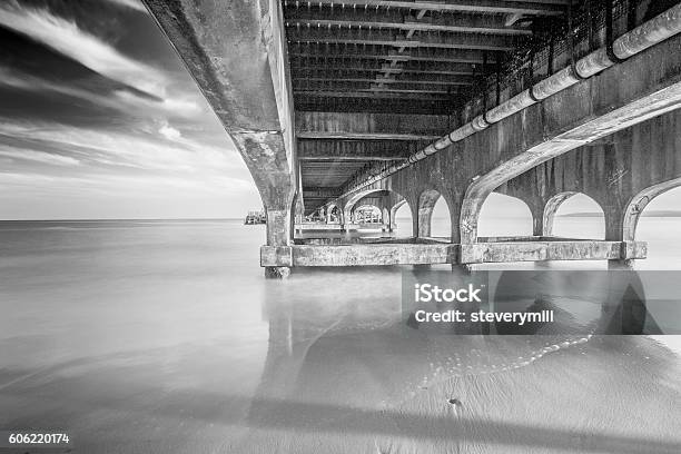 Underneath Bournemouth Pier In Mono Stock Photo - Download Image Now - Beach, Bournemouth - England, Cloud - Sky