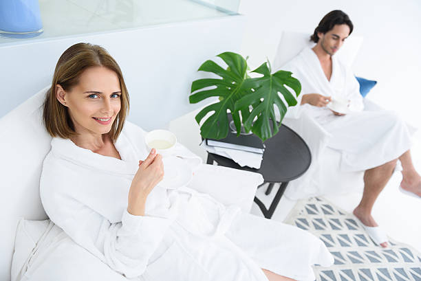 istock Loving mature couple enjoying day spa 606220632
