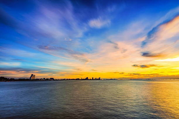 istock Low light long exposure scenery of pattaya with colorful sunset 606222202