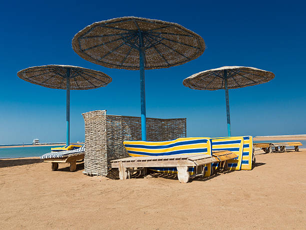 istock Sunshade umbrellas on the beach 606223744