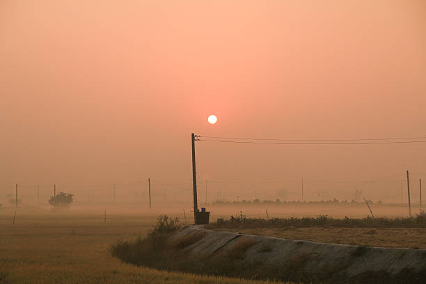 istock sunrise on the fall field with fog 606226130