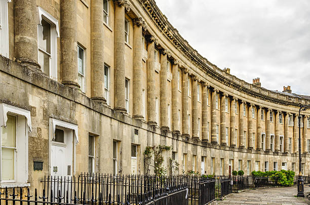 Royal Crescent Homes of Bath, England The Royal Crescent is a row of 30 historic terraced homes in the city of Bath, England. Georgian architecture. bath england photos stock pictures, royalty-free photos & images