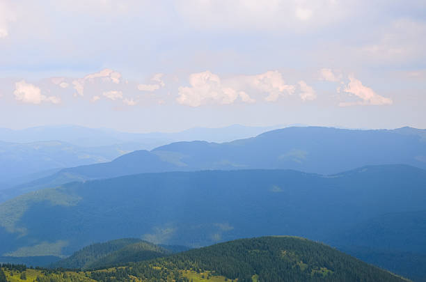 istock Misty beech forest on the mountain slope in nature reserve 606226382
