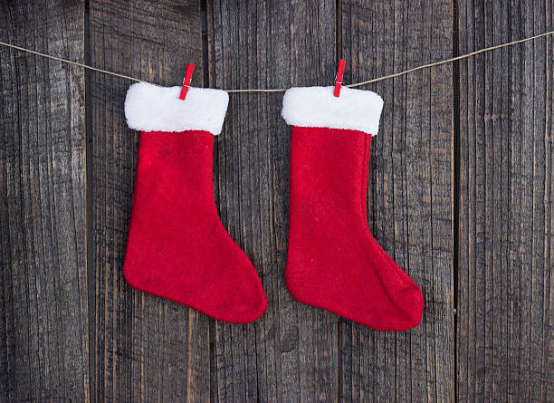 istock frames and christmas decor on rope over rustic wooden board 606226420