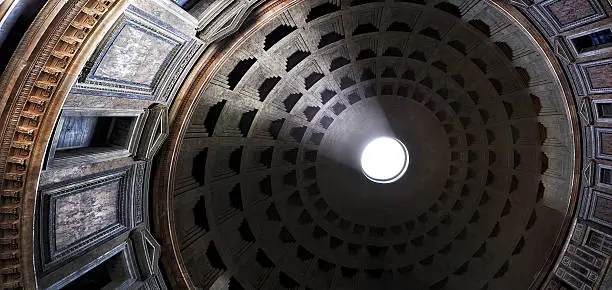 The Pantheon, Rome, Italy. Light shining through an oculus in the ceiling. Detail from plafond. 