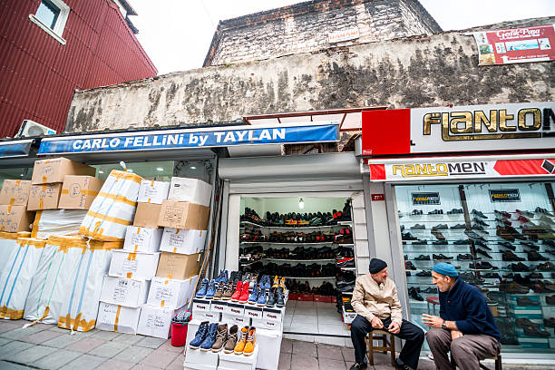 Istanbul, Turkey  - October 29, 2014: Men selling shoes in Istanbul, Turkey