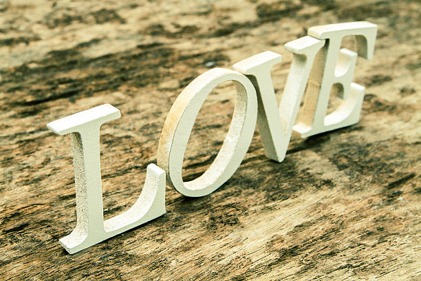 istock Word LOVE on old wood background 606230134