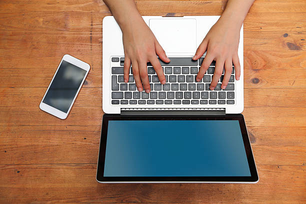 istock Hands of young woman using laptop 606233970