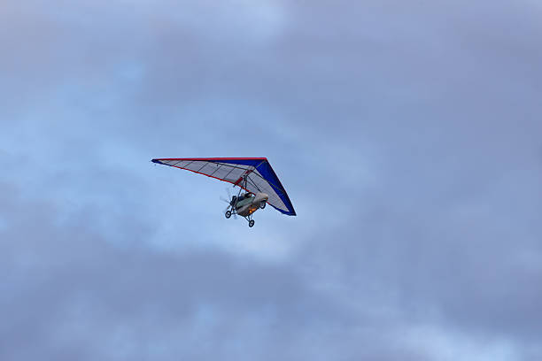 istock trike on a background of clouds 606234728