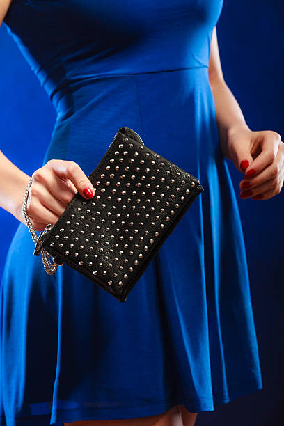 istock Evening handbag in woman hand 606234882