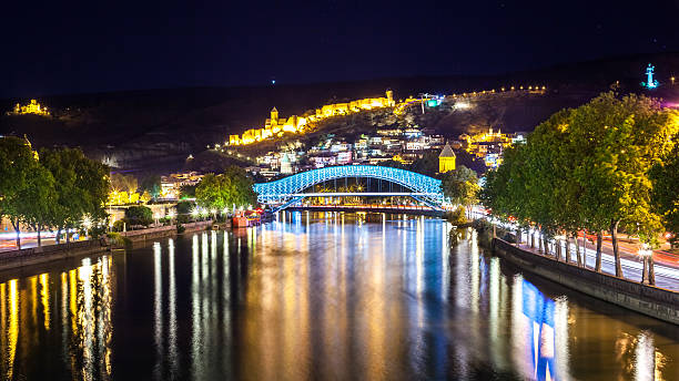 istock Tbilisi downtown. peace bridge made from glass, river Mtkvari, a 606235078