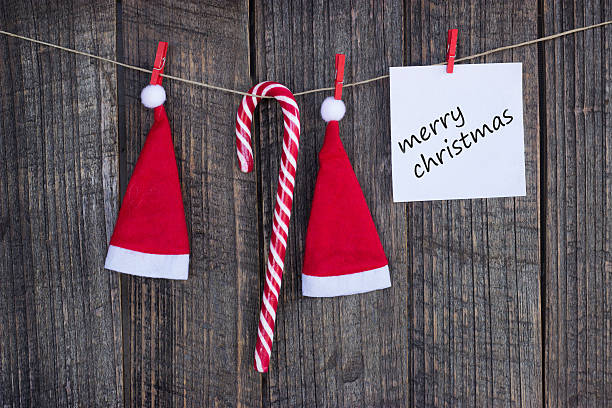 istock Santa's hat hanging on wooden background 606235622