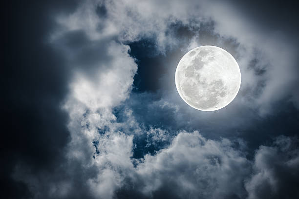 istock Nighttime sky with cloudy and bright full moon. Outdoors. 606236008