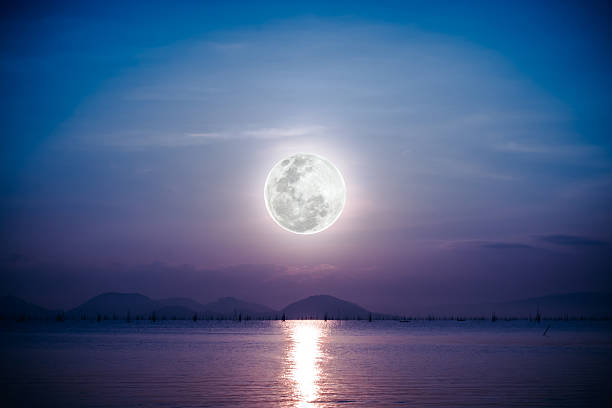 istock Romantic scenic with full moon on sea to night. 606236248