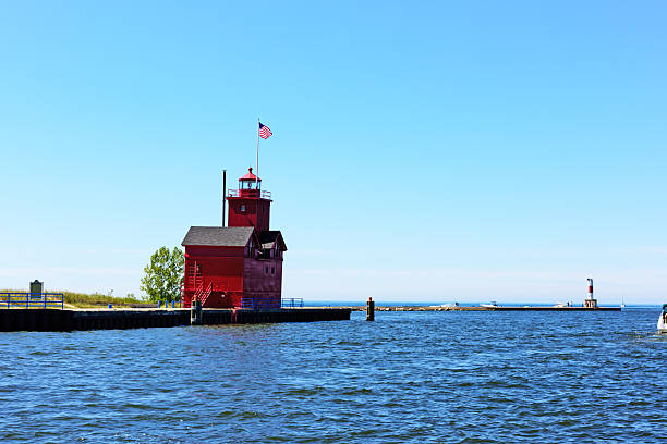 istock Red lighthouse and harbor entrance, Holland, Michigan 606236836