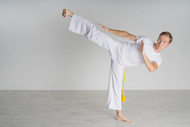 istock Man in sportswear performing a kick. 606237164