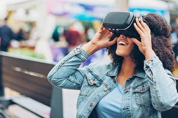 istock Young woman with virtual reality headset 606238082