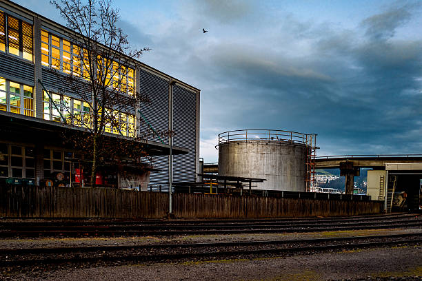 istock Railroad Tracks Against Industrial Building 606373791