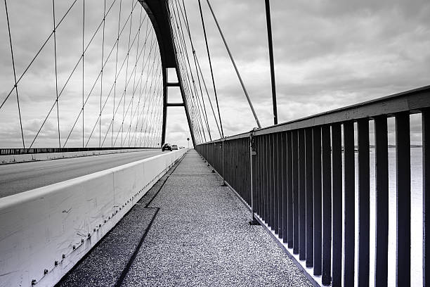 istock Street At Bridge Against Cloudy Sky 606396293