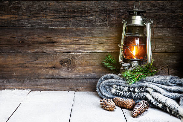 Kerosene lantern and snow stock photo
