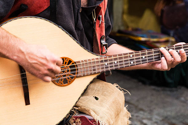 istock street musician playing 606637722