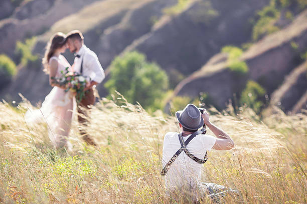 fotografo in azione  - men african descent giving flower foto e immagini stock