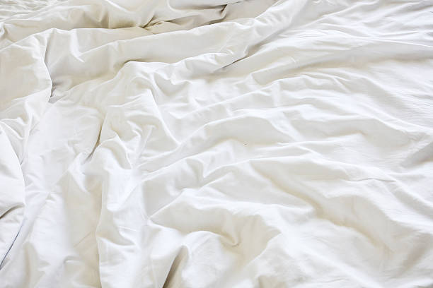 istock wrinkle messy blanket in bedroom 606640576
