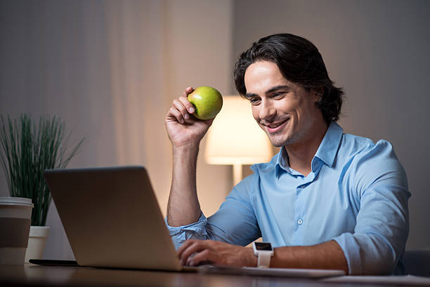 istock Good looking young man working on laptop. 606641290