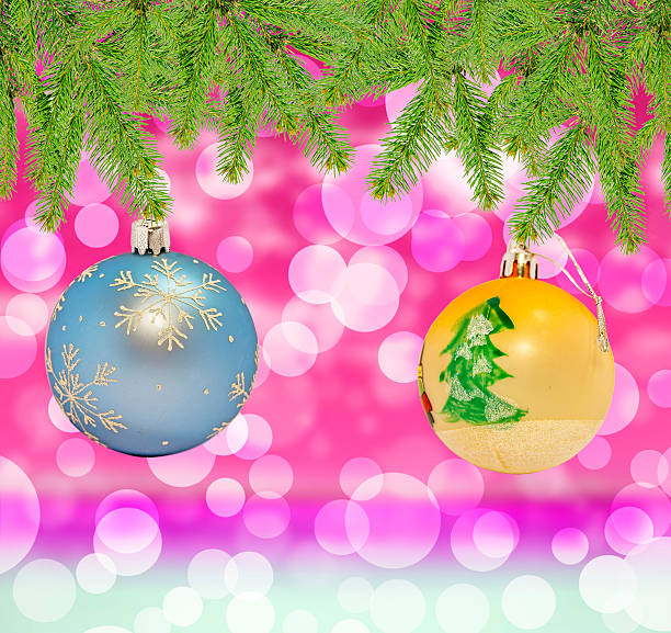 istock Christmas decorative blue and yellow ball on bokeh background 606641454