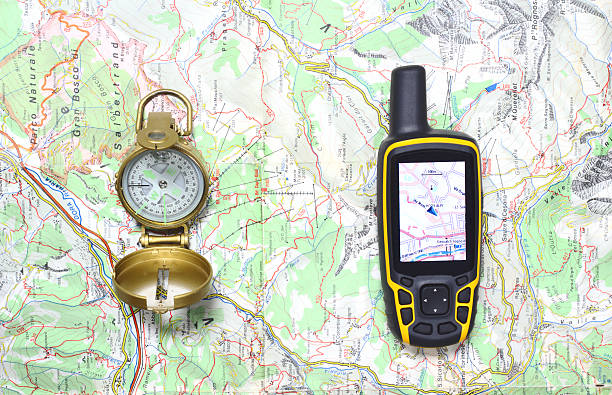Compass and GPS receiver on a map. stock photo
