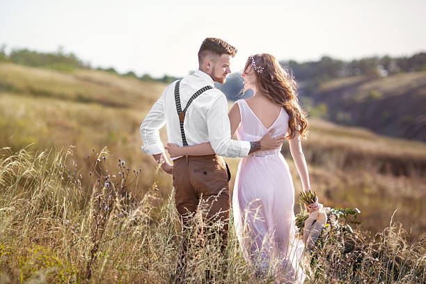 bride and groom hugging at the wedding - male beauty imagens e fotografias de stock