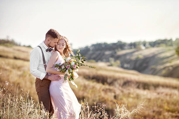 istock bride and groom hugging at the wedding 606642036