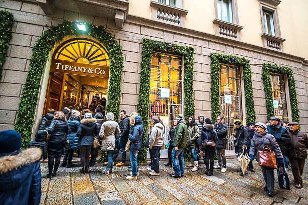 Milan, Italy - December 27, 2014: Christmas shopping in Milan, Tiffany & Co. People waiting in line to enter the shop. 